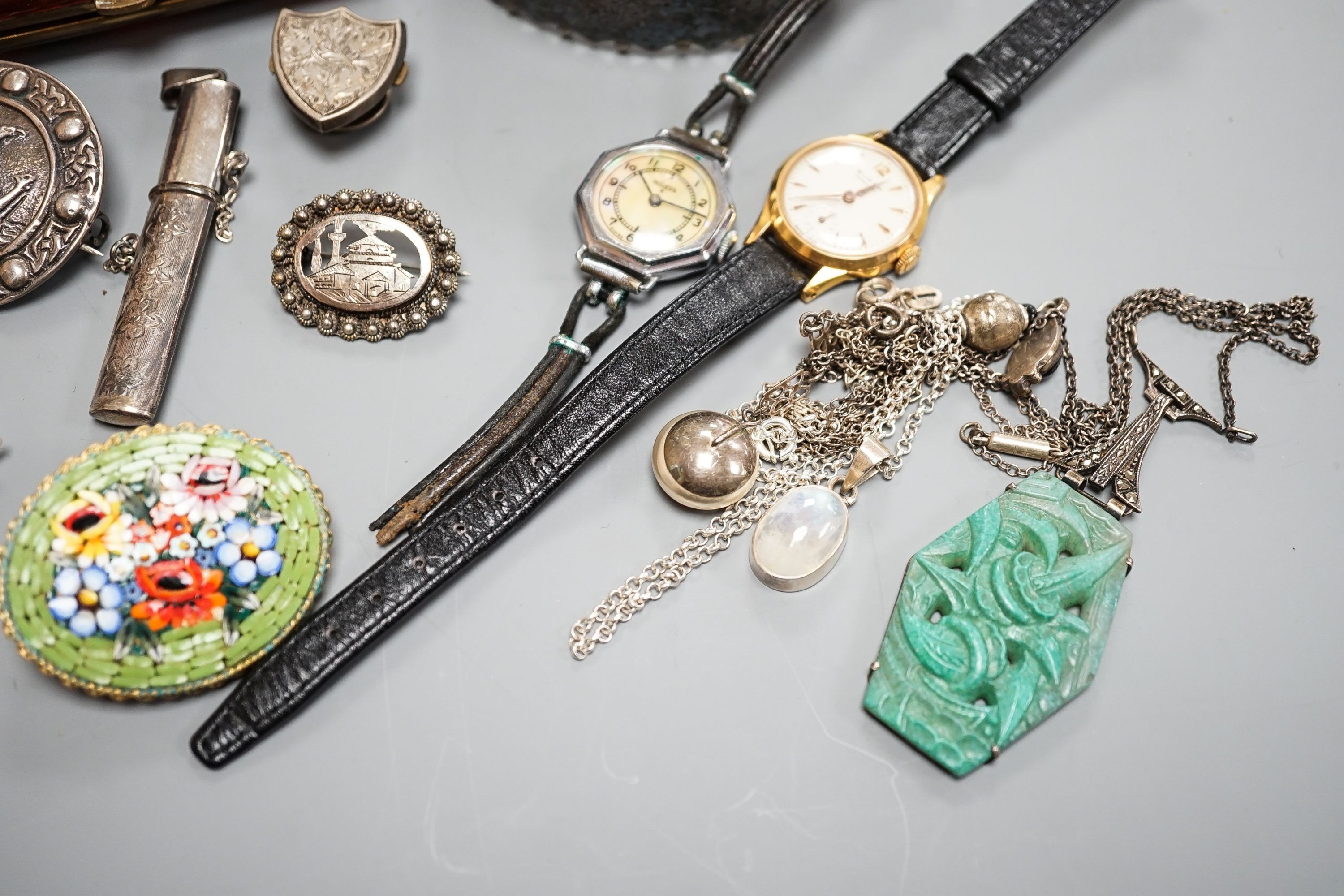 An engraved silver bangle, two silver brooches, including Scottish, two lady's wrist watches and a small group of minor jewellery, etc.